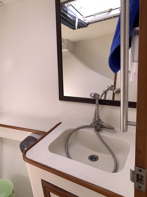 Bathroom with a mirror and sink.