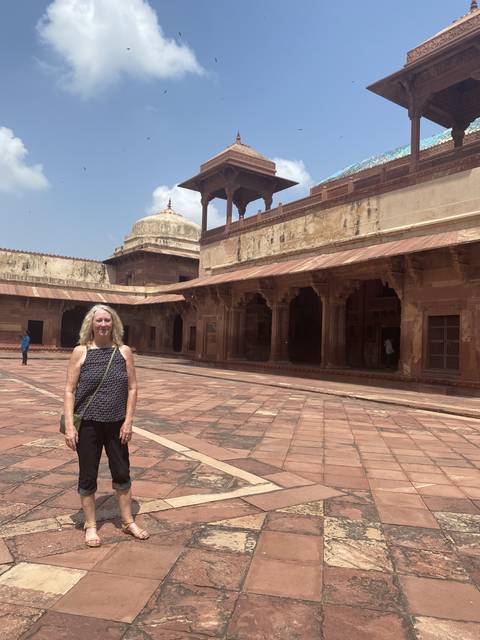 Woman posing at a historical site.