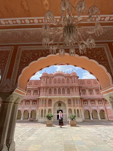Palace architecture framed by an arched doorway.