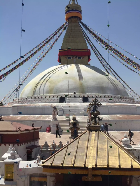 Boudhanath Stupa with colorful prayer flags.