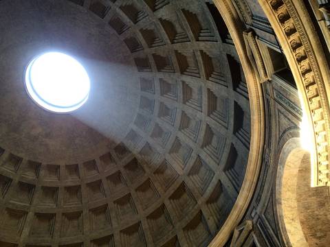 Interior of the Pantheon with light streaming through the oculus.