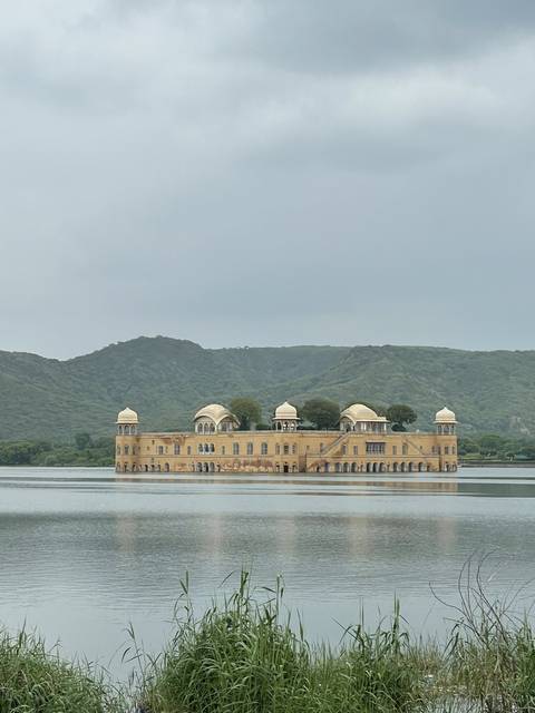 A palace partially submerged in a lake.