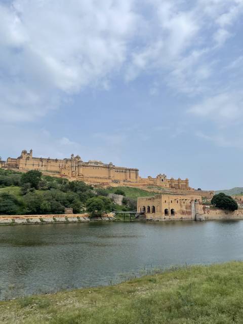 A large fortress with water in the foreground.