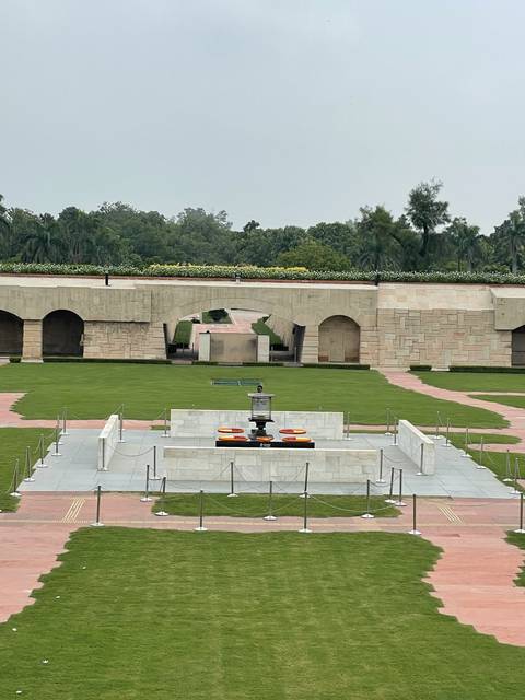 A modern memorial site with an eternal flame.