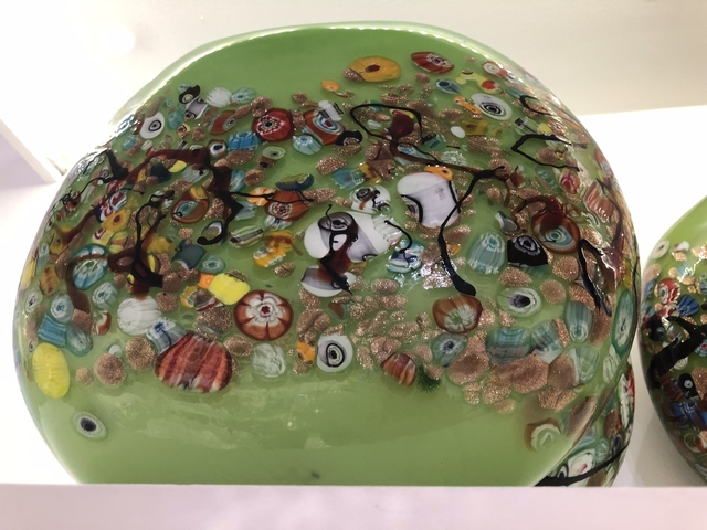 Close-up of colorful glass art with intricate patterns.