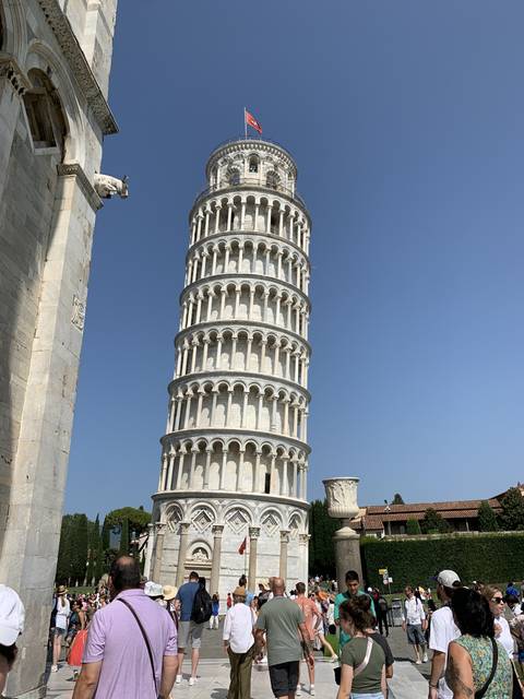 Tourists in front of the Leaning Tower of Pisa.