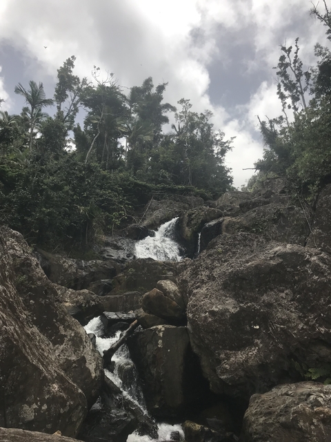 Small waterfall amid rocky terrain.