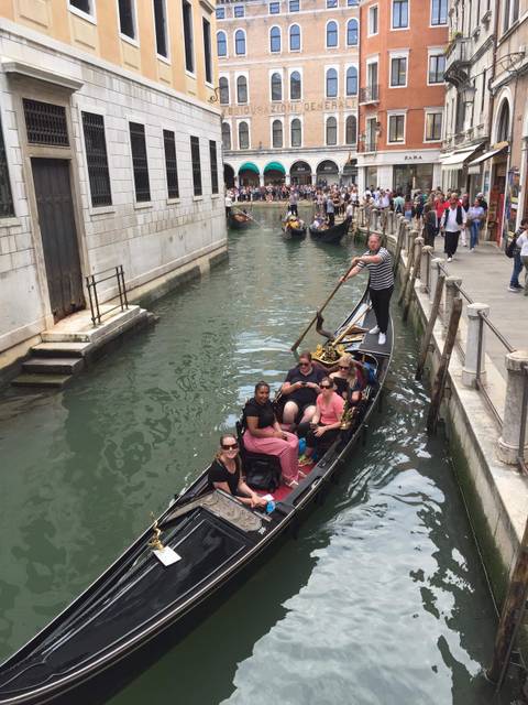 Gondola ride on a Venetian canal.