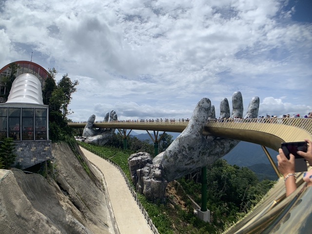 Golden Bridge in Da Nang with giant stone hands holding the bridge.