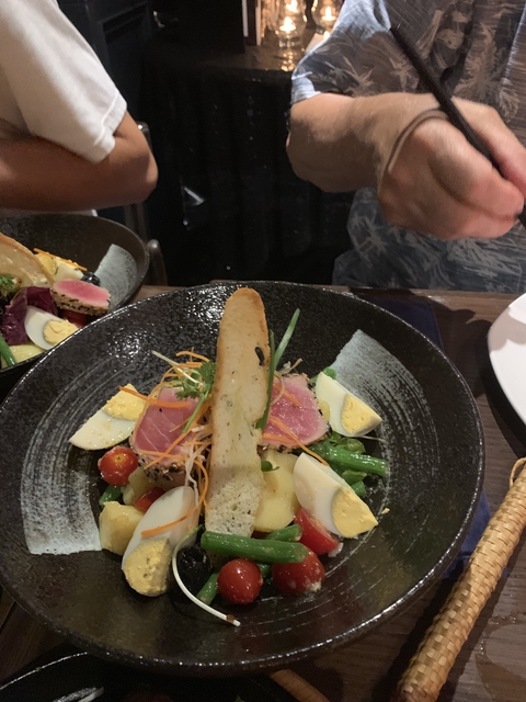 Beautifully presented dish with tuna and vegetables.