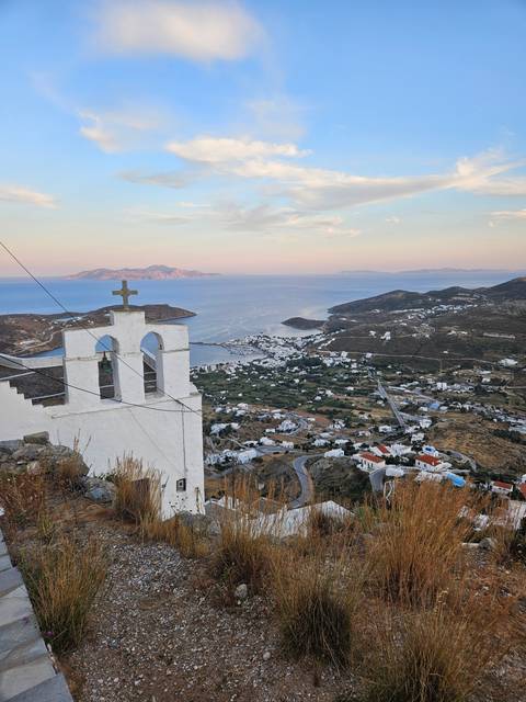 Aerial view of a town with a church bell tower.