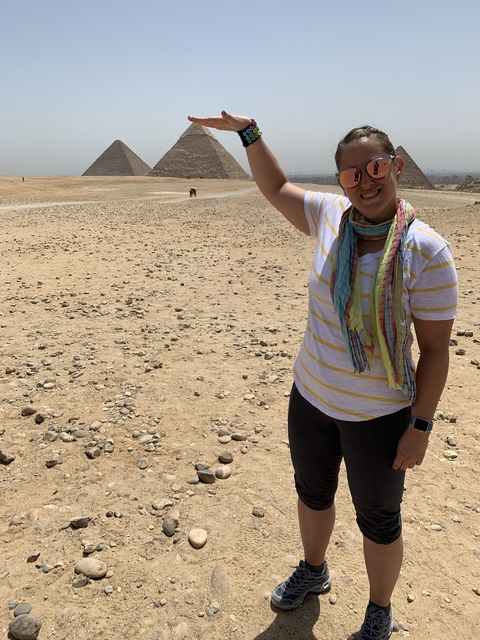 Woman posing playfully in the desert.