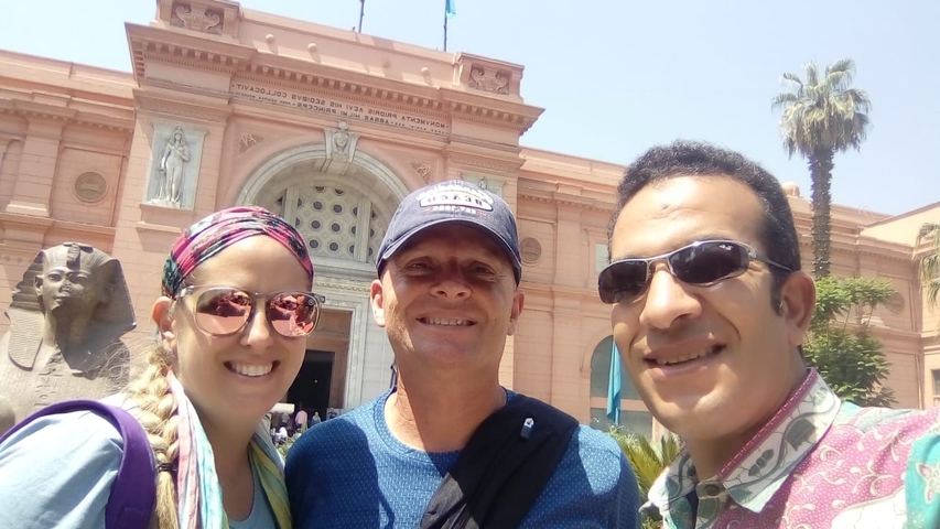 Group in front of an Egyptian-style museum.
