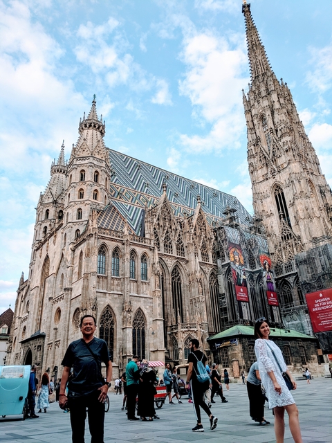 Ornate Gothic-style church with a patterned roof.