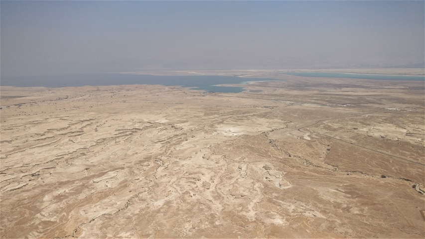 Desert landscape with a distant body of water