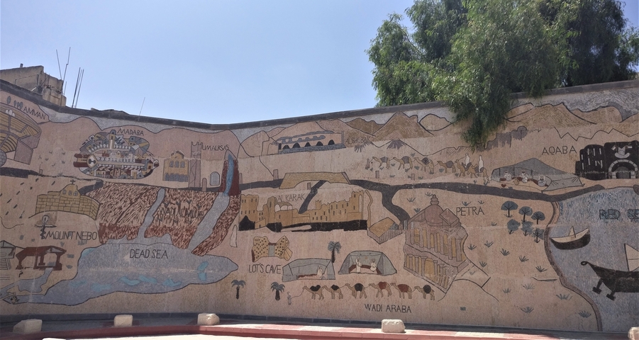 Mosaic mural depicting landmarks in a city