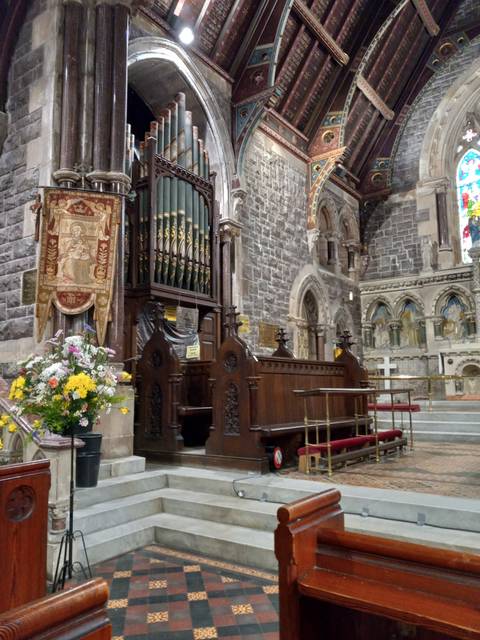 Interior of a historic church with ornate ceiling.