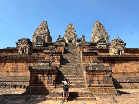 Ruins of an ancient temple with detailed carvings and steps.