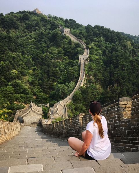 Person looking at the Great Wall of China.