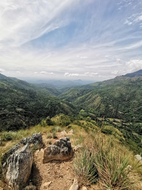 Panoramic view of lush green valleys and mountains.
