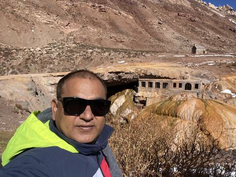 Portrait of a man in front of mountain landscape