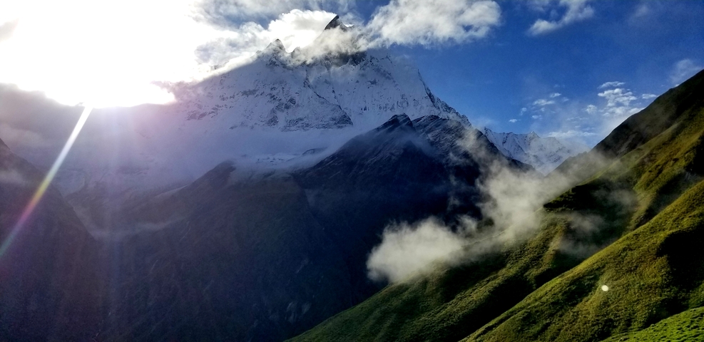 Majestic mountain peak under a dramatic sky.