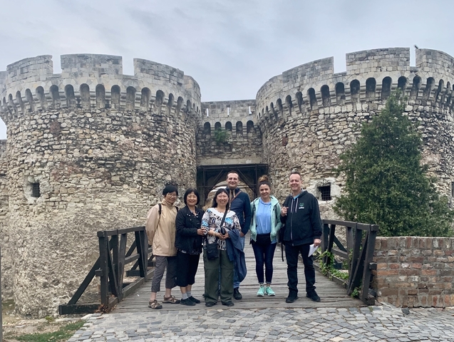 Group photo in front of a historic fort.