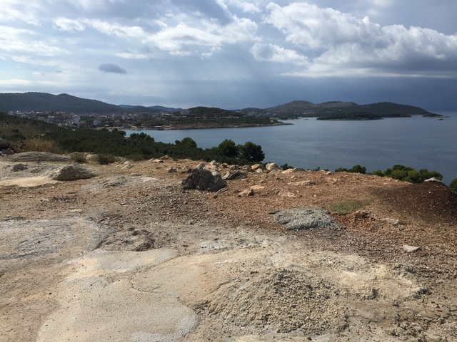 Coastal landscape with distant islands.
