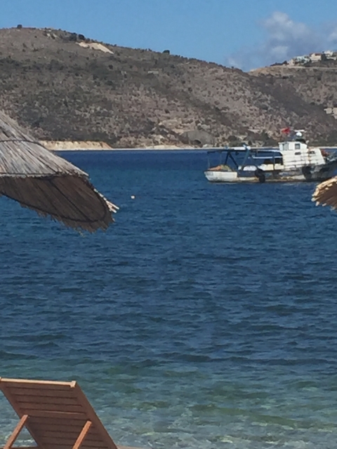 Blurry image of the sea with boats.