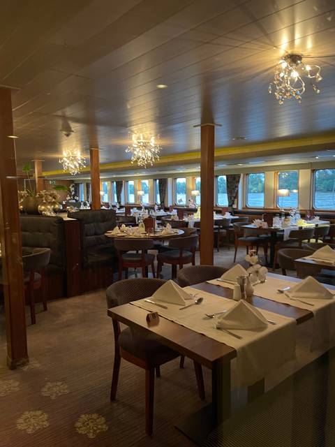 Interior of a dining room on a cruise ship.