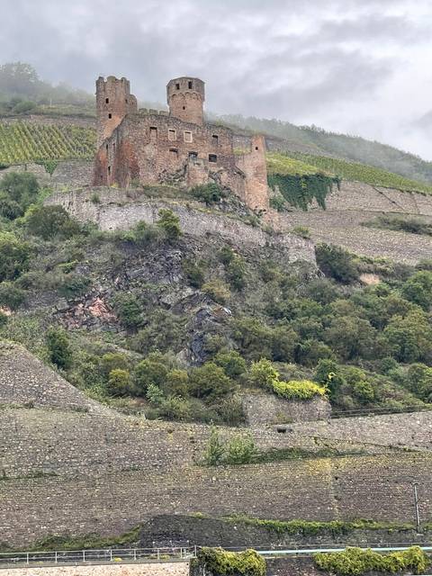 Ruins of a castle on a hillside.