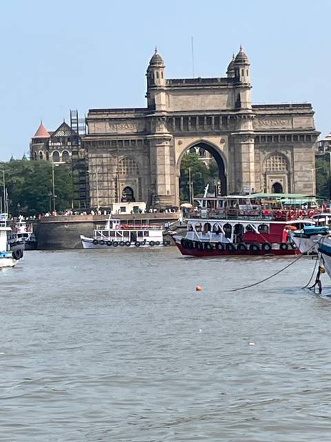 A view of a landmark building near water, appears to be rotated.