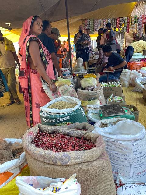 A market stall with various grains and spices.