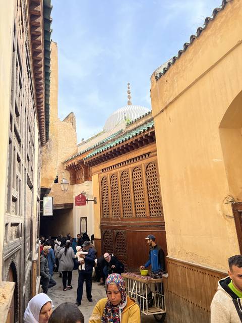 Crowded street with wooden doorway