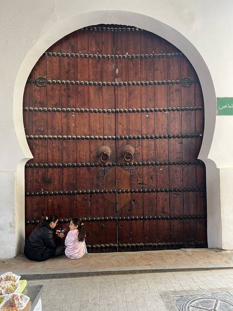 Large wooden door with two people