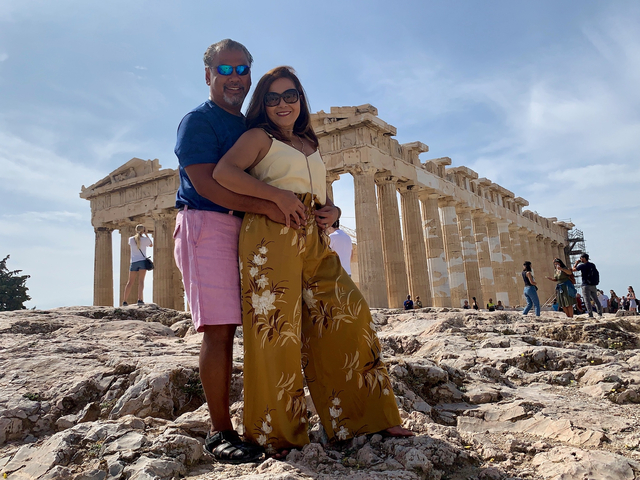 Couple posing in front of the Parthenon in Athens.