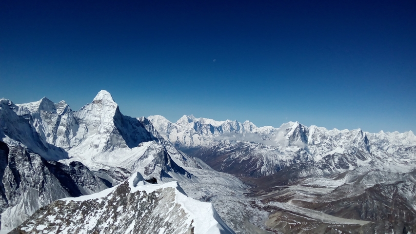 Panoramic view of snow-covered mountain peaks.
