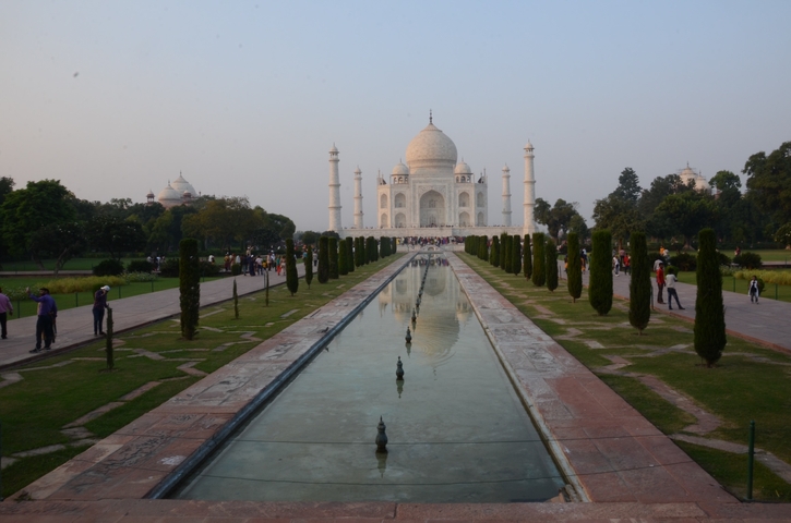 Iconic view of the Taj Mahal with its reflection in a long pool.