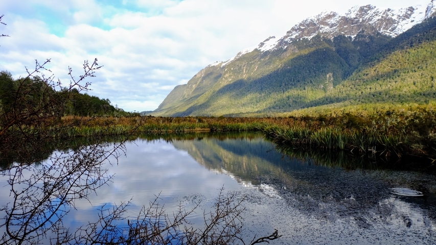 Reflection of snow-capped mountains in a lake.
