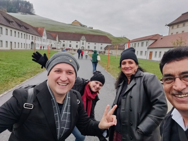 Group of people posing on a historic pathway.