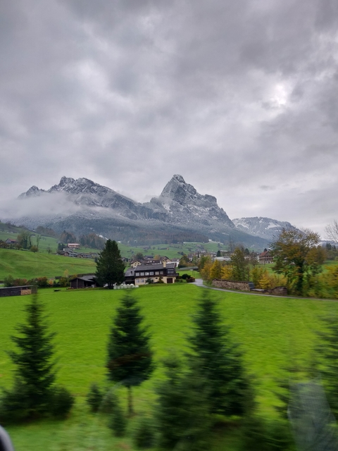 Snow-capped mountain with a village in the foreground.