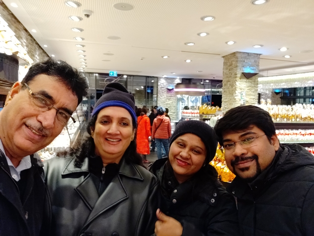 Group of people in a lit indoor setting.