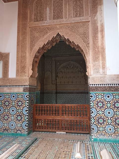 Intricate stone and tile architecture with doorway.