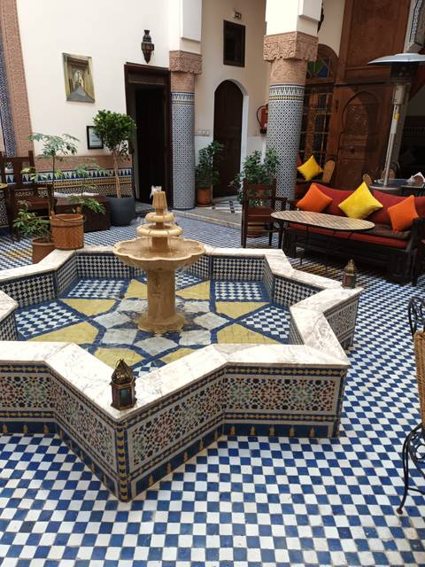 Decorative tiled courtyard with fountain.