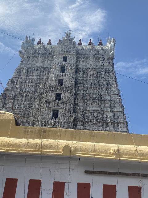 Elaborate temple facade with intricate carvings reaching the sky.