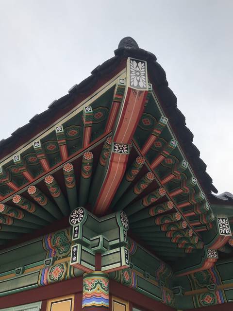 Intricate painted details of a traditional Asian building.