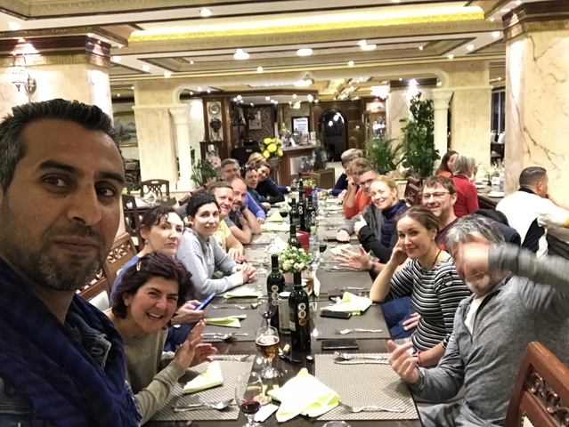 Group of people dining together in a lavish restaurant.