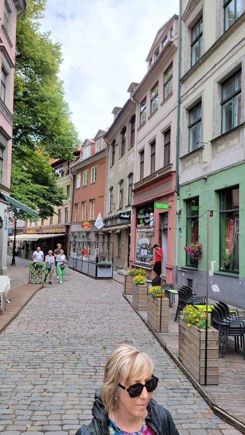 Colorful street with people walking and enjoying the atmosphere.