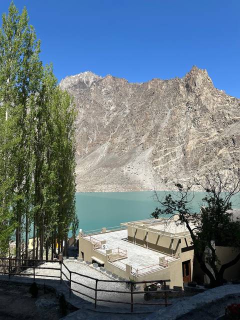 Lakeside with mountains and blue sky.