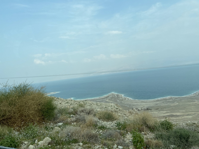 View of a coastline with a large body of water.